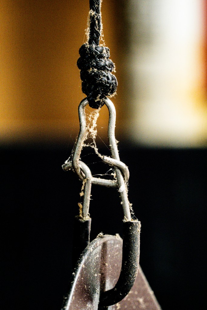 Hanging from the shop ceiling.